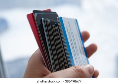 A Pile Of Plastic Cards In The Hand