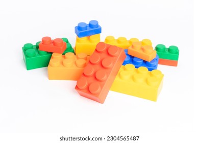 pile plastic toy blocks on white background - Powered by Shutterstock