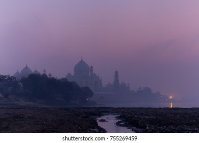 The Pile Of Plastic Trash And Other Garbage In Yamuna River With Taj Mahal In Twilight Background. Problem Of Garbage Pollution. Agra. Uttar Pradesh. India. Asia. 