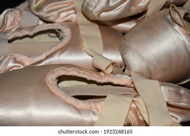 Pile Of Pointe Shoes On The Floor