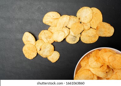 Pile Of Potato Chips. Crisps On Background. Potato Chips Is Snack In Bag