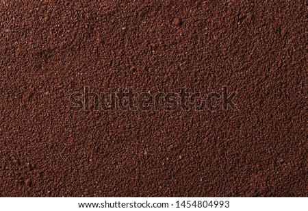 Pile of powdered, instant coffee background and texture, top view