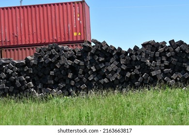 Pile Of Railroad Ties By A Train Car