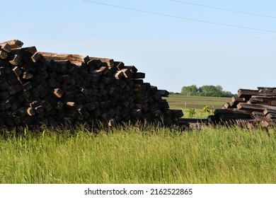 Pile Of Railroad Ties In A Field