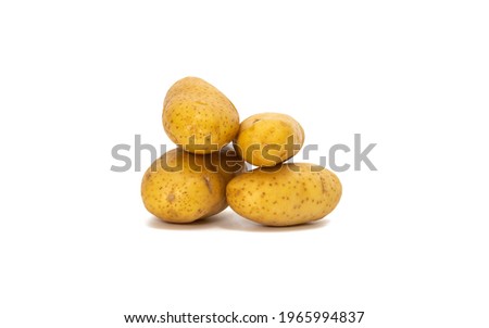 Pile of raw potatoes isolated on a white background.