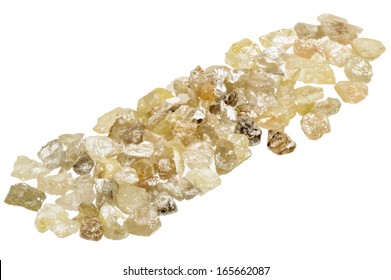 A Pile Of Raw, Uncut Natural Diamonds On White