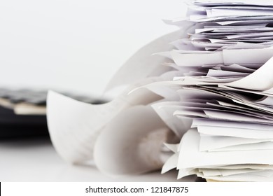Pile Of Receipts On The Desk