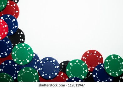 Pile Of Red, Green, Black, And Blue Poker Chips Isolated On White Background