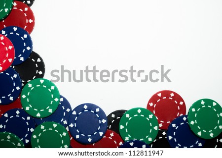 Pile of red, green, black, and blue poker chips isolated on white background