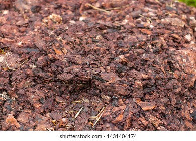 A pile of red mulch