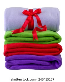 A Pile Of Rolled Fleece Blankets . Clipping Path.