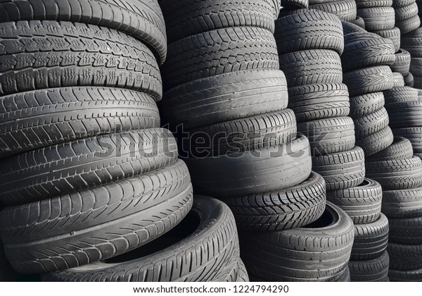 Pile of rubber automotive tyres, car tyres\
recycling background
