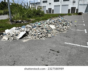 Pile of rubble or construction waste on parking space. Preventing car to park. - Powered by Shutterstock