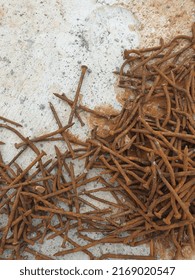 pile of rusty nails on the concrete floor