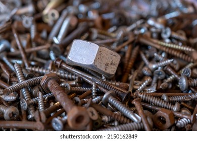 Pile of rusty nails and small hardware nuts, nuts and bolts, hardware concept, selective focus, rusty nails background