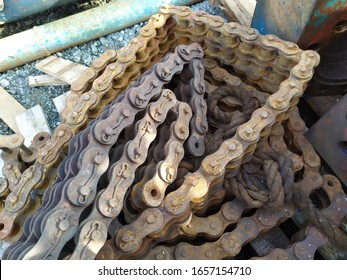 pile of rusty old machine chains.
the image is out of focus because it is using a smartphone camera
