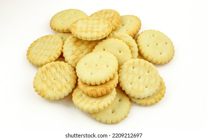 Pile Of Salty Round Crackers Isolated On White Background