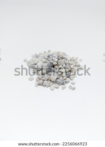 Pile of Sand quartz or gravel silica sand isolated on white background. Quartz sand known as sand filter is used in finishing construction materials, water filter treatment and agriculture