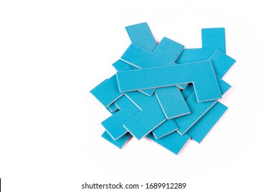 Pile of scattered blue geometrical pieces, simple shapes stack, heap Bunch of unlinked not connected elements isolated on white cut out Parts for building, constructing, putting together, mess concept