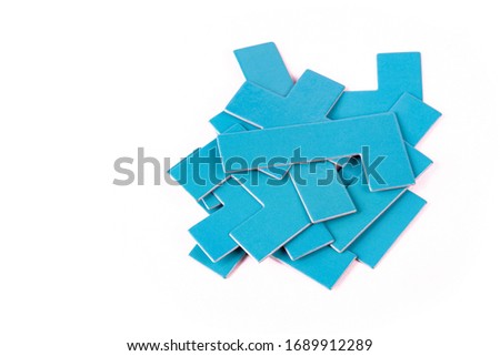 Pile of scattered blue geometrical pieces, simple shapes stack, heap Bunch of unlinked not connected elements isolated on white cut out Parts for building, constructing, putting together, mess concept