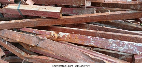 Pile of scrap metal, hollow square pipe, scrap metal, scrap metal trading business - Shutterstock ID 2110099799