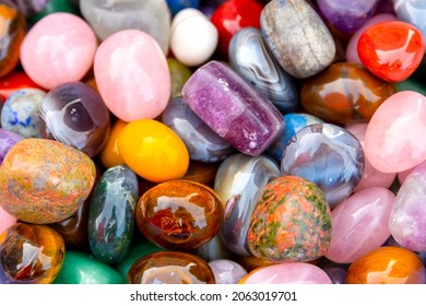 А pile of semi-precious, precious stones, close-up. The best natural material for interior design, jewelry craftsmanship. Background, texture.  - Shutterstock ID 2063019701
