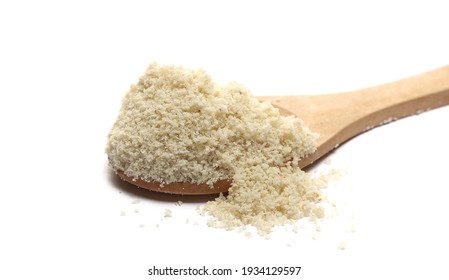 Pile sesame protein powder in wooden spoon isolated on white background 