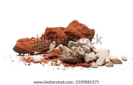 Pile shattered red bricks pieces and stone isolated on white  