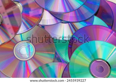 Pile of shiny compact discs pattern background