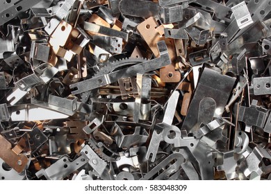 Pile Of Shiny Metal Parts. Scrap Polished Steel Details. Abstract Industrial Background.