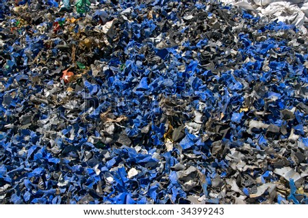 A pile of shredded plastic containers for recycling