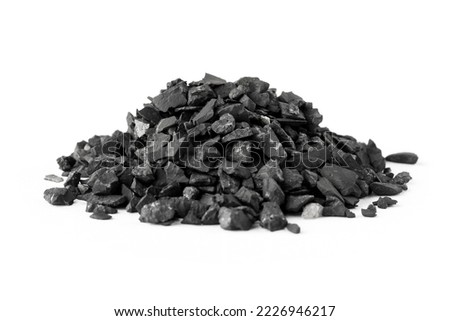 A pile of shungite on a white background. natural mineral. Close-up