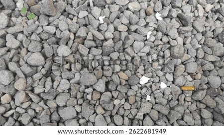 A pile of small, angular gray stones, likely 
