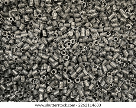 A pile of socket screws aka allen head screws are ready to be shipped