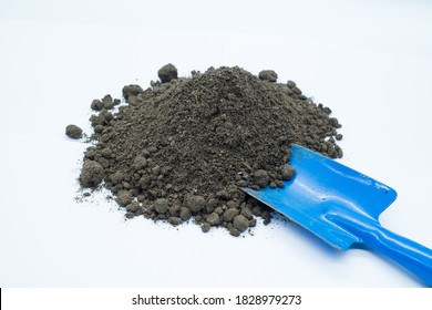 Pile Of Soil And Small Shovel Isolated On White Background.