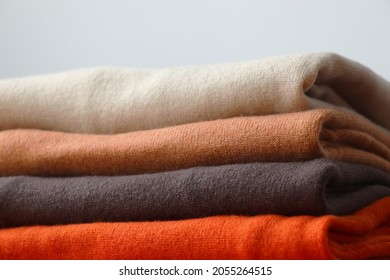 Pile Or Stack Of Fall Colour, Folded Cashmere Or Merino Wool Jumpers.