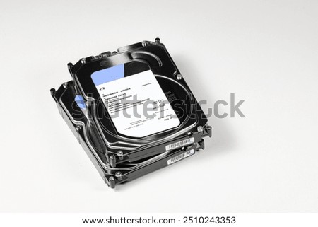 pile or stack of Hight capacity HDD, hard disk drives 3.5" standard profile show on SATA interface, isolated on white background.