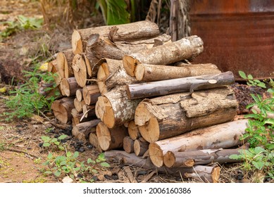 A pile of stacked firewood, prepared for heating the house, Firewood harvested for heating in winter, Chopped firewood on a stack, Firewood stacked and prepared for winter Pile of wood logs. - Powered by Shutterstock