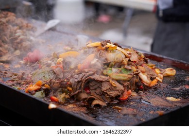 Pile Of Steaming Sautéed Beef And Vegetables