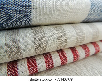 Pile Of Striped White Grey Blue Red Linen Cotton Fabrics On White Background. Different Colors. Food Photo Props. Natural Linen Cotton Fabric. 