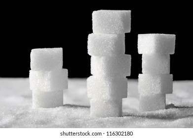 Pile Of Sugar Cubes On Black And White Background