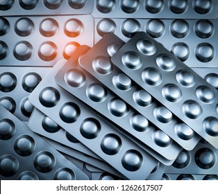 Pile Of Tablets Pill In Blister Packaging To Protect Medicine From Light. Silver Aluminium Foil Blister Pack. Pharmaceutical Industry. Pharmacy Products. Drug Recall And Withdrawal From Market Concept