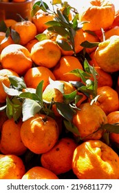 Pile Of Tangerines In Backlight, At Outdoor Market Stall. Brazil