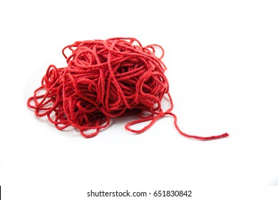 Pile of tangled red yarn with a single end leading out. Isolated on white
