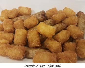 Pile Of Tater Tots And Turkey Sausage