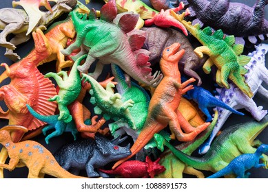 Pile Of Toy Plastic Dinosaurs.