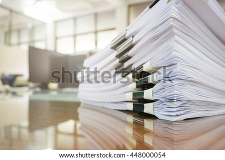 Pile of unfinished documents on office desk, Stack of business paper