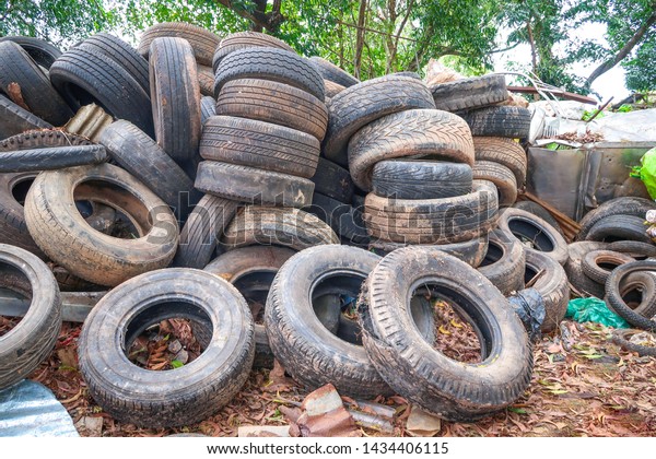 Pile used car tires for\
recycling