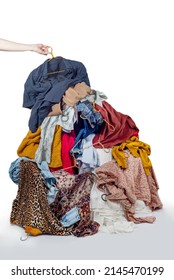 Pile with used clothes. The concept of sustainable fashion. Pile of used clothes on a light background. Second hand for recycling
