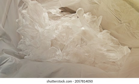 A Pile Of Used Disposable Plastic Gloves In Outdoor Trash Bin At Supermarket To Protect Customers Against Coronavirus Covid-19.